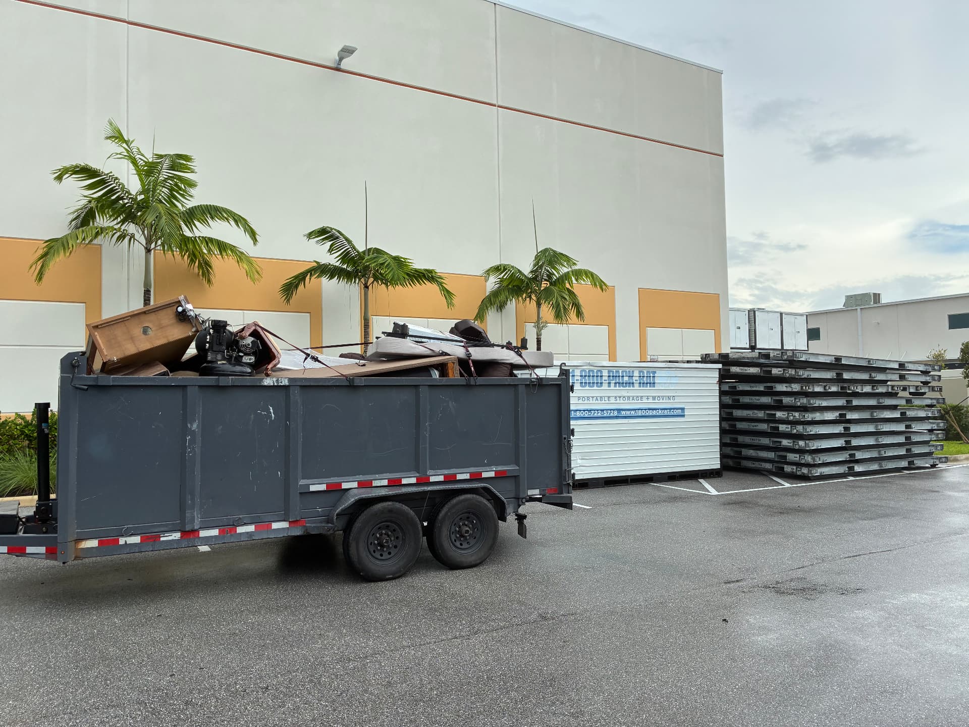 Before and after: loaded dump trailer and 1-800-PACK-RAT storage container, then emptied by All Out Rubbish (before)