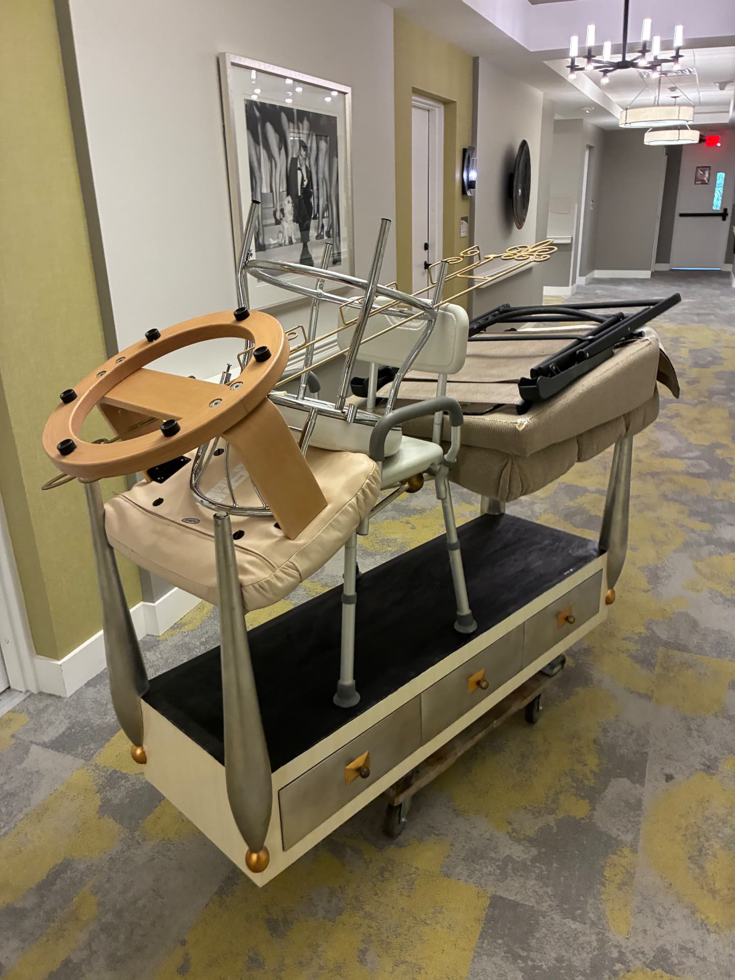 All Out Rubbish crew clearing furniture, shower chair, and benches from an assisted-living facility hallway in Palm Beach County, Florida